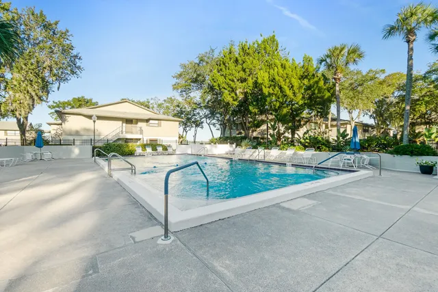 a view of a swimming pool with a patio
