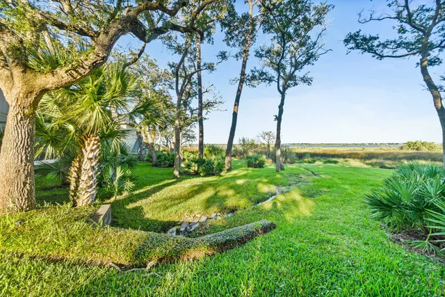 a front view of a house with outdoor seating