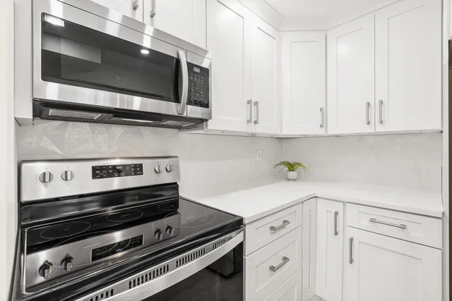 a kitchen with a sink and refrigerator