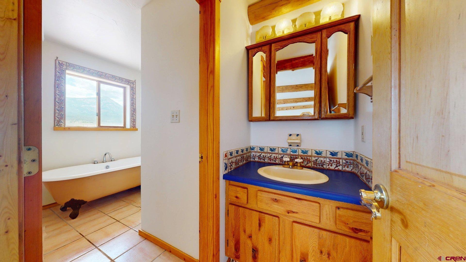 40557 M75 Road Paonia, CO 81428 - Photo 24 of 34 a bathroom with a sink and a bathtub