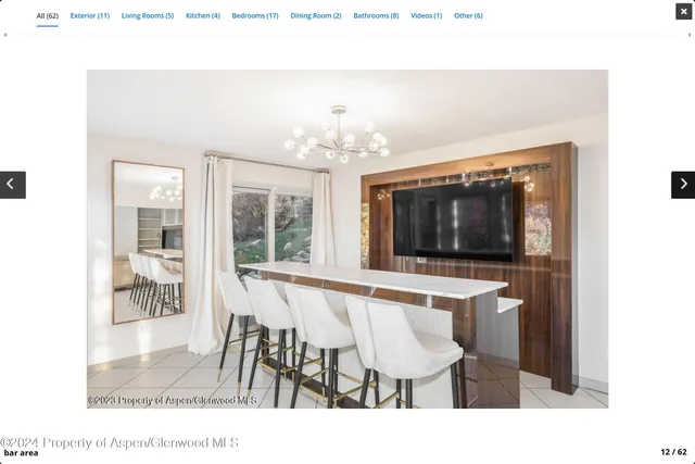 a dining room with a table and chairs