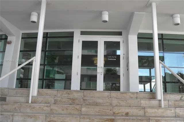 a kitchen with a sink and a mirror