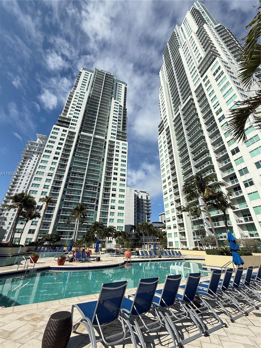 253 Northeast 2nd Street, Unit 908 Miami, FL 33132 - Photo 2 of 47 a front view of a building with outdoor seating