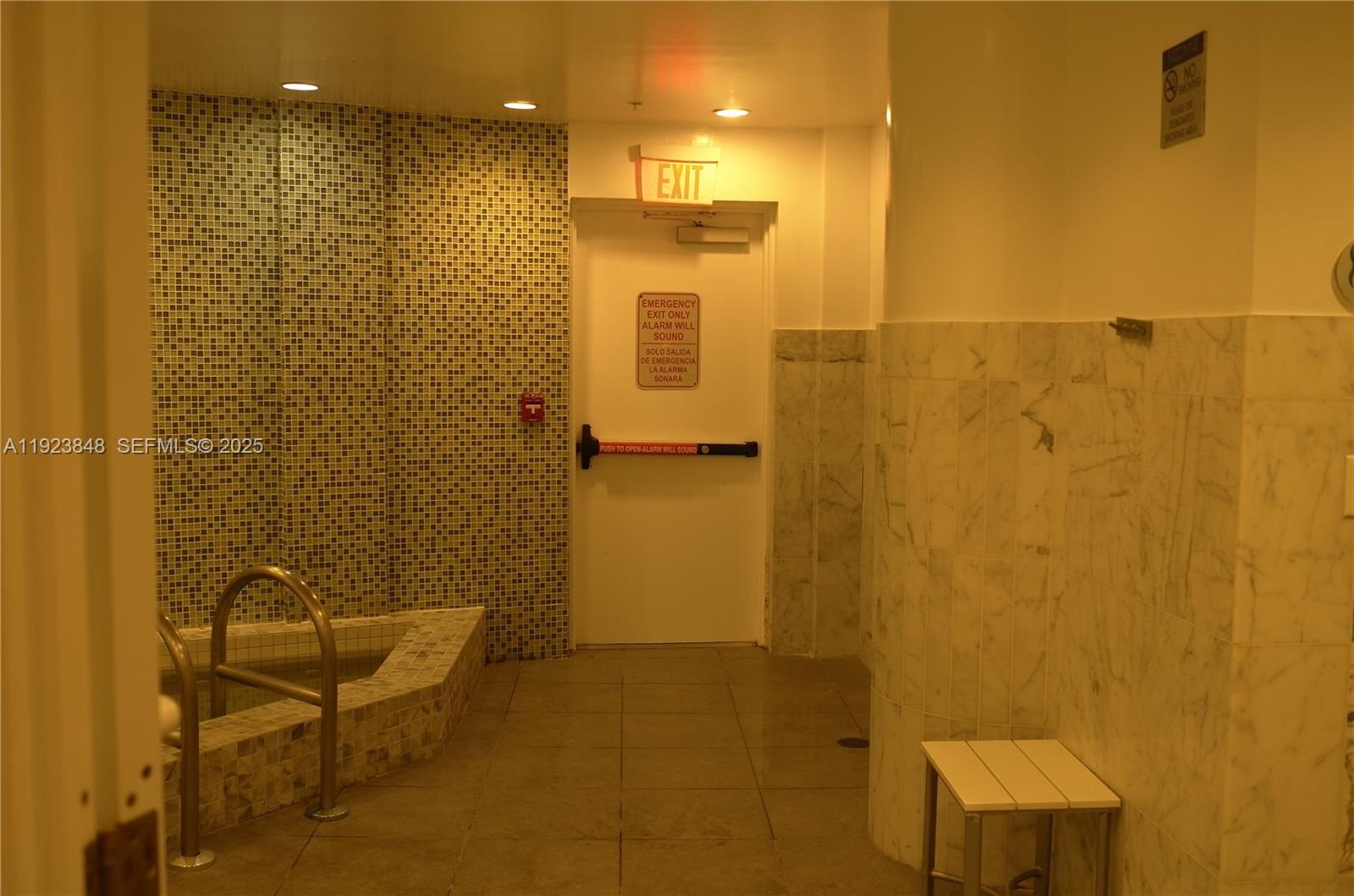 253 Northeast 2nd Street, Unit 908 Miami, FL 33132 - Photo 24 of 47 a bathroom with a shower