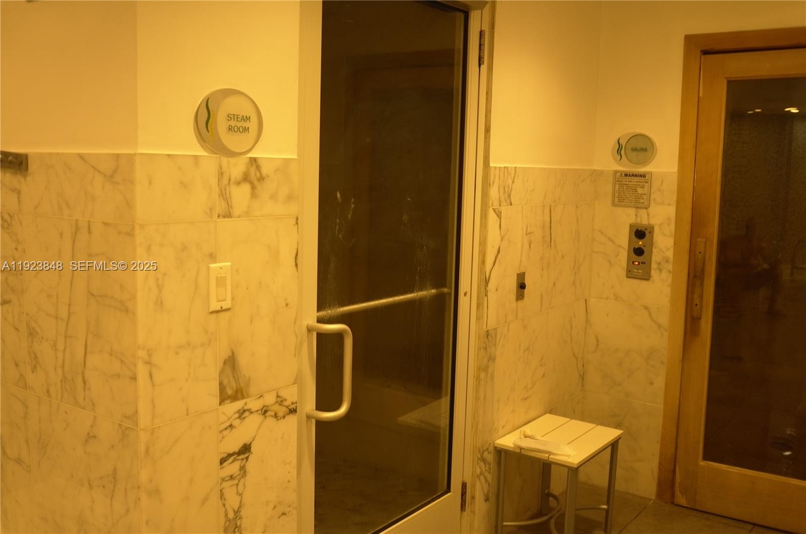 253 Northeast 2nd Street, Unit 908 Miami, FL 33132 - Photo 25 of 47 a bathroom with a shower