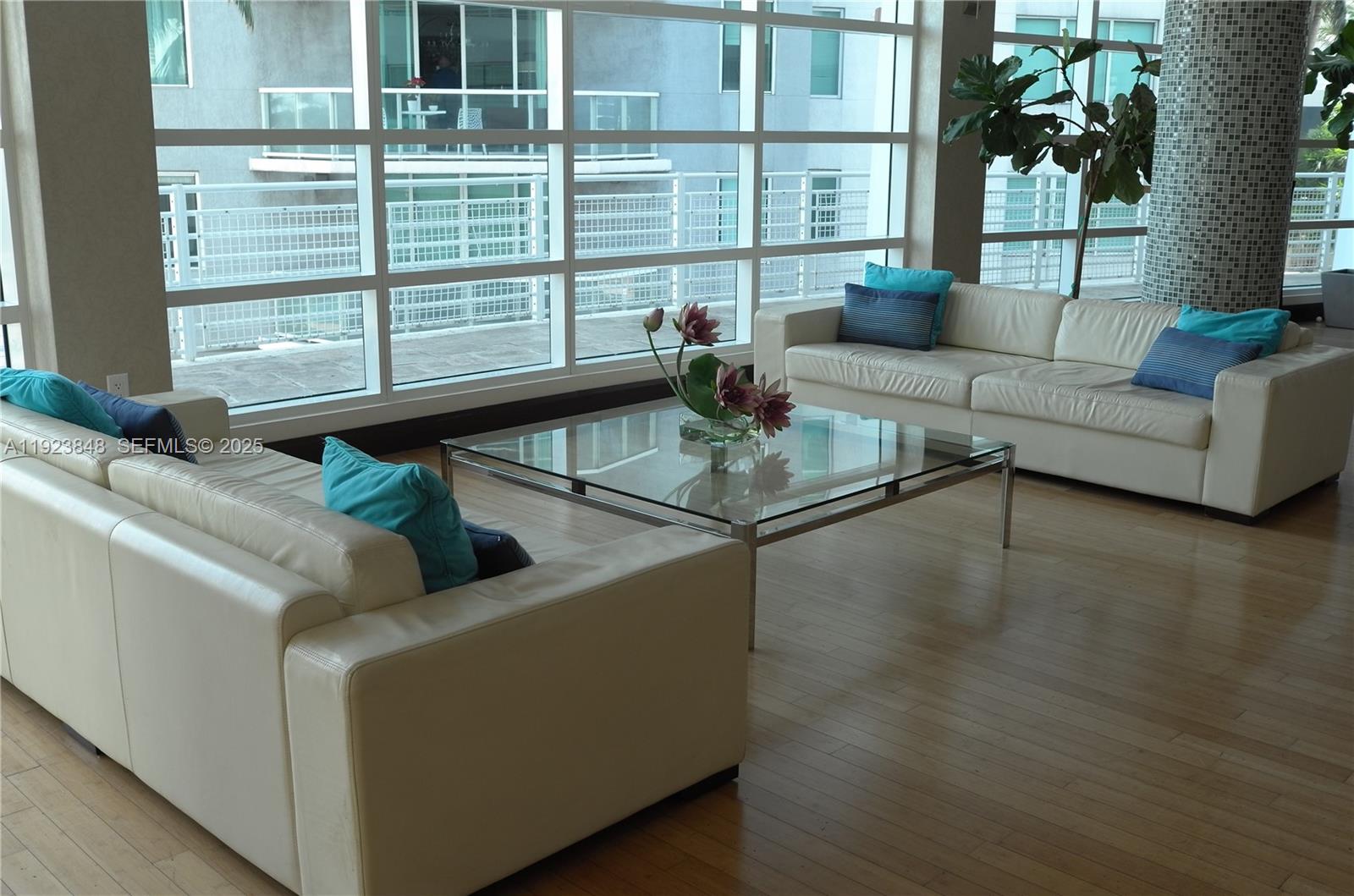 253 Northeast 2nd Street, Unit 908 Miami, FL 33132 - Photo 29 of 47 a living room with furniture and a large window