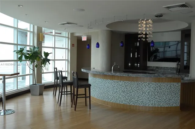 a view of a bathroom with shower and a sink