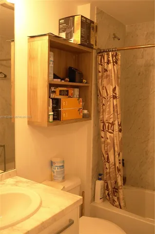 a kitchen with stainless steel appliances a refrigerator stove and microwave