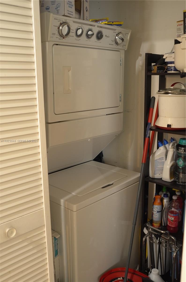 253 Northeast 2nd Street, Unit 908 Miami, FL 33132 - Photo 38 of 47 a utility room with dryer and washer