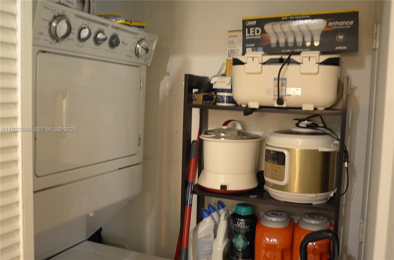253 Northeast 2nd Street, Unit 908 Miami, FL 33132 - Photo 39 of 47 a utility room with dryer and washer