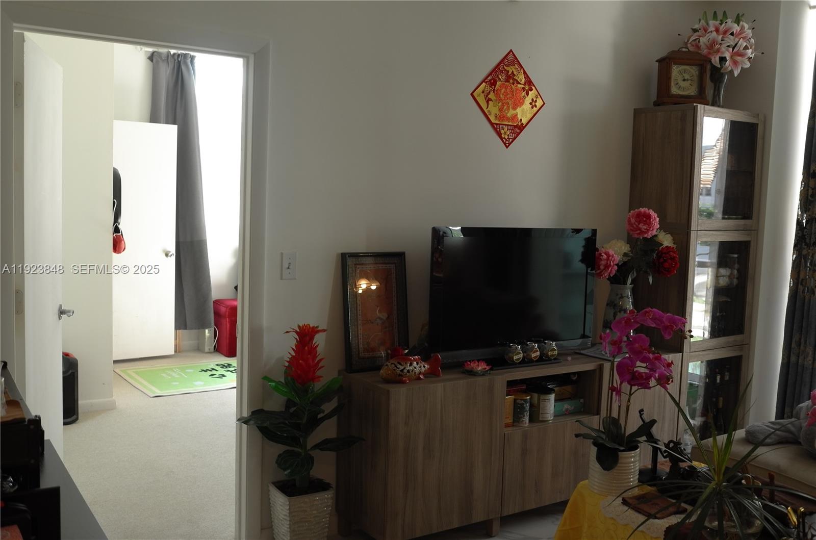 253 Northeast 2nd Street, Unit 908 Miami, FL 33132 - Photo 41 of 47 a room with furniture and a flat screen tv