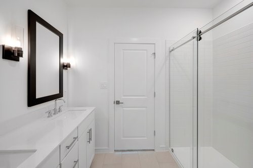 7914 Jasper Mdws Way Angleton, TX 77515 - Photo 16 of 33 Primary bathroom with framed mirrors and oversized shower