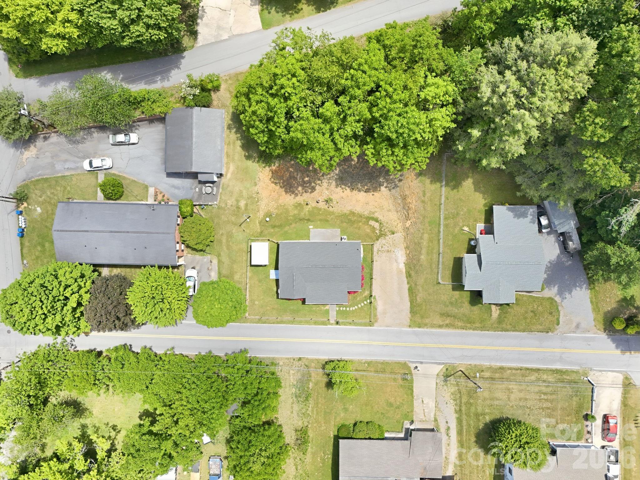 197 Mulberry Street Clyde, NC 28721 - Photo 29 of 31 an aerial view of a house with a yard basket ball court and outdoor seating