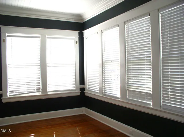 a view of empty room with windows