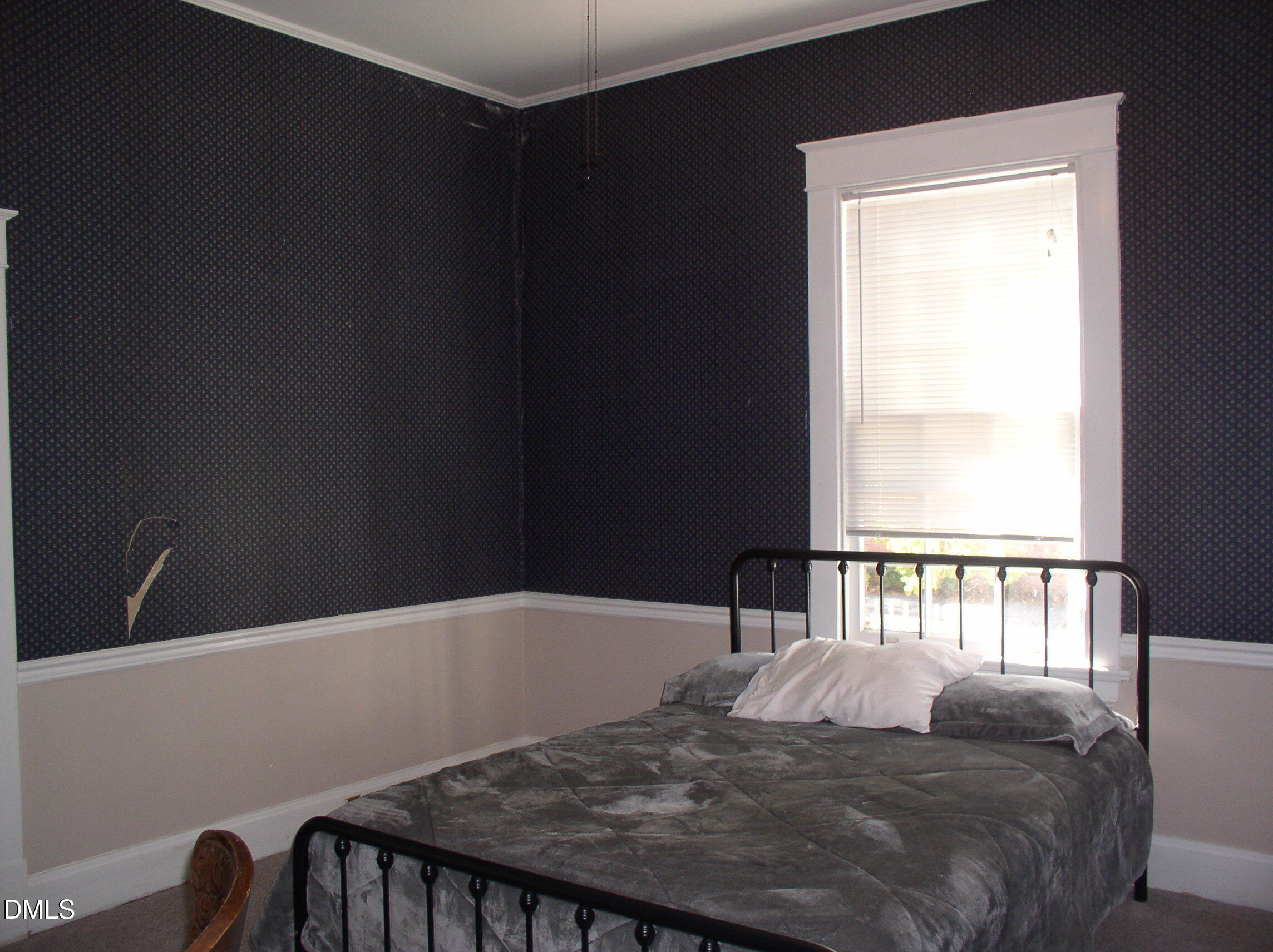 934 South Chestnut Street Henderson, NC 27536 - Photo 16 of 56 a bedroom with a bed and a window