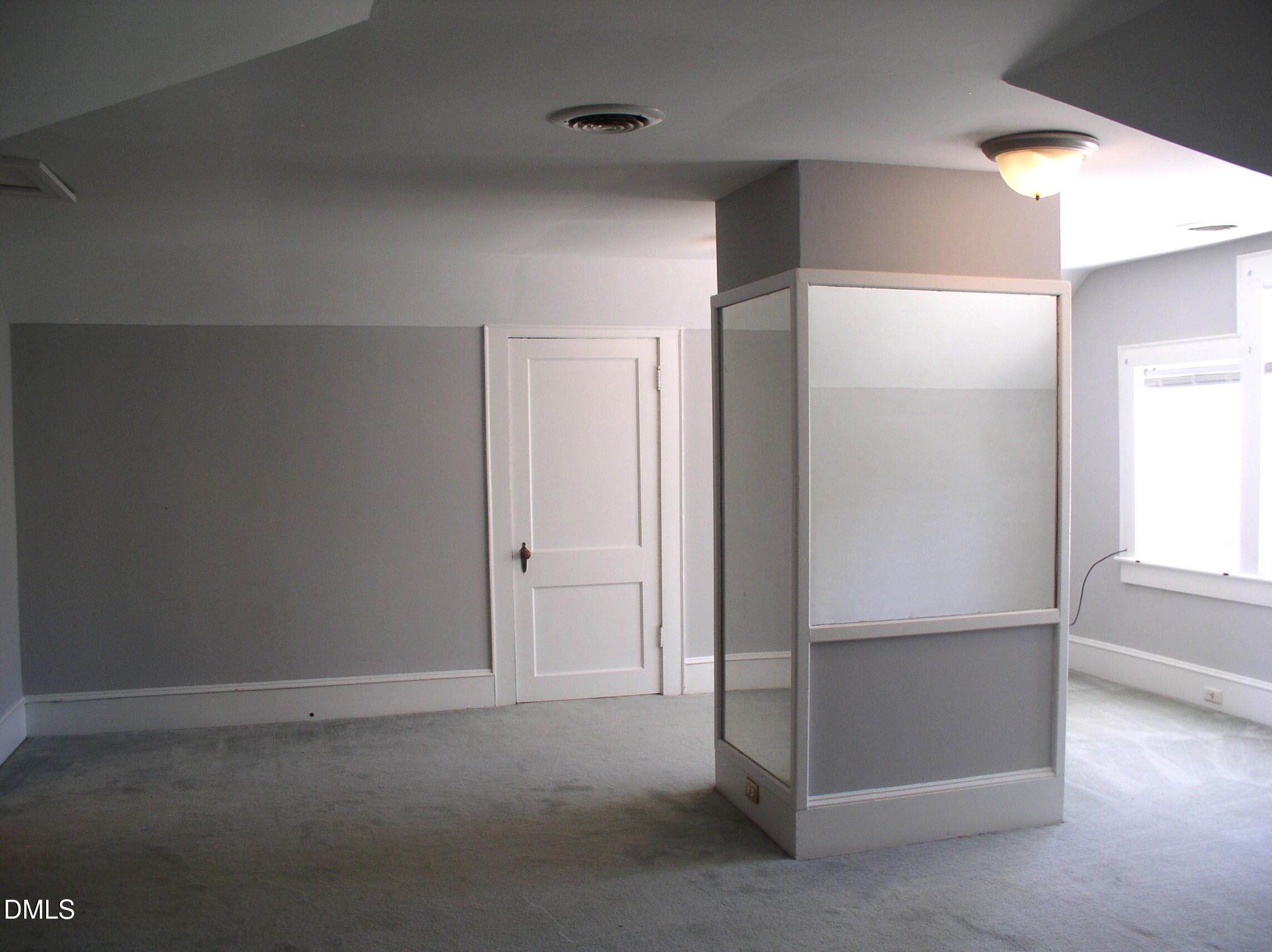 934 South Chestnut Street Henderson, NC 27536 - Photo 23 of 56 an empty room with windows