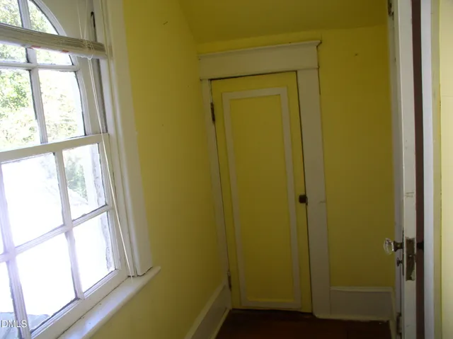 an empty room with windows