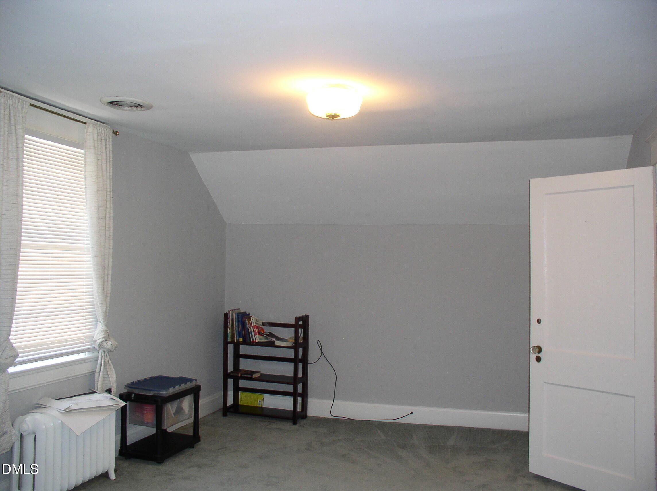 934 South Chestnut Street Henderson, NC 27536 - Photo 29 of 56 a view of a livingroom with furniture and a window