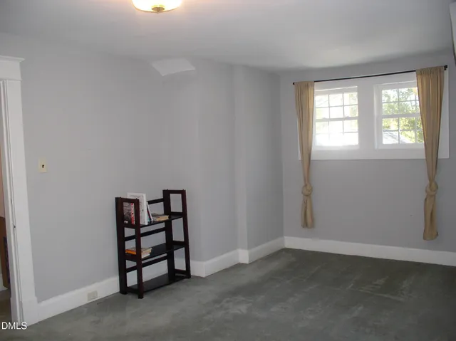 a view of entryway with a wooden fence