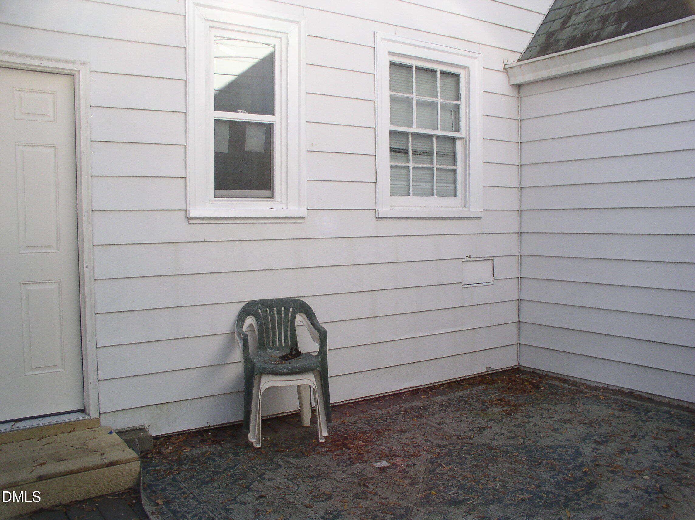 934 South Chestnut Street Henderson, NC 27536 - Photo 34 of 56 a view of a bench in back yard of a house