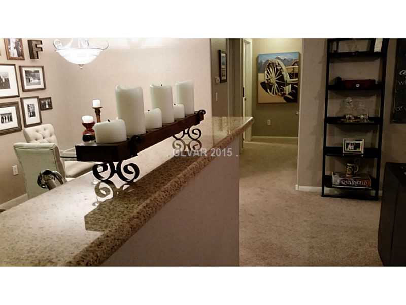 7701 West Robindale Road, Unit 145 Las Vegas, NV 89113 - Photo 13 of 34 Kitchen. Breakfast bar