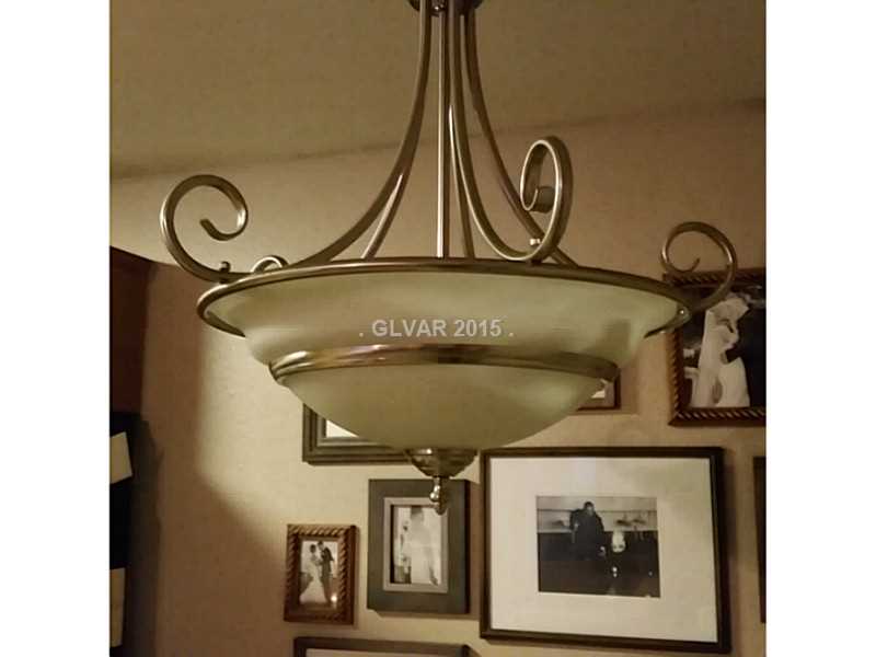 7701 West Robindale Road, Unit 145 Las Vegas, NV 89113 - Photo 19 of 34 Kitchen. Quality lighting in dining