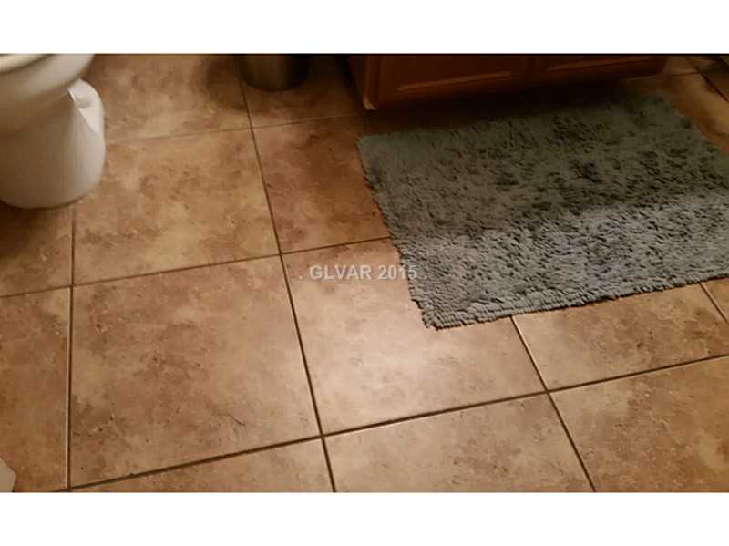 7701 West Robindale Road, Unit 145 Las Vegas, NV 89113 - Photo 24 of 34 Bathroom. Ceramic tile in bathroom