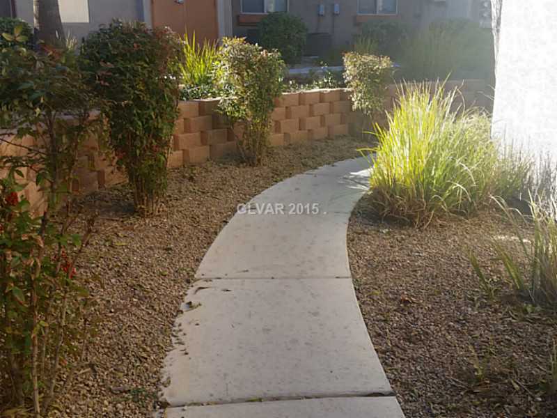 7701 West Robindale Road, Unit 145 Las Vegas, NV 89113 - Photo 3 of 34 Facade/Exterior Front. Pathway to home