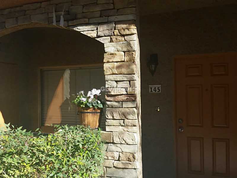 7701 West Robindale Road, Unit 145 Las Vegas, NV 89113 - Photo 4 of 34 Facade/Exterior Front. Front door/patio