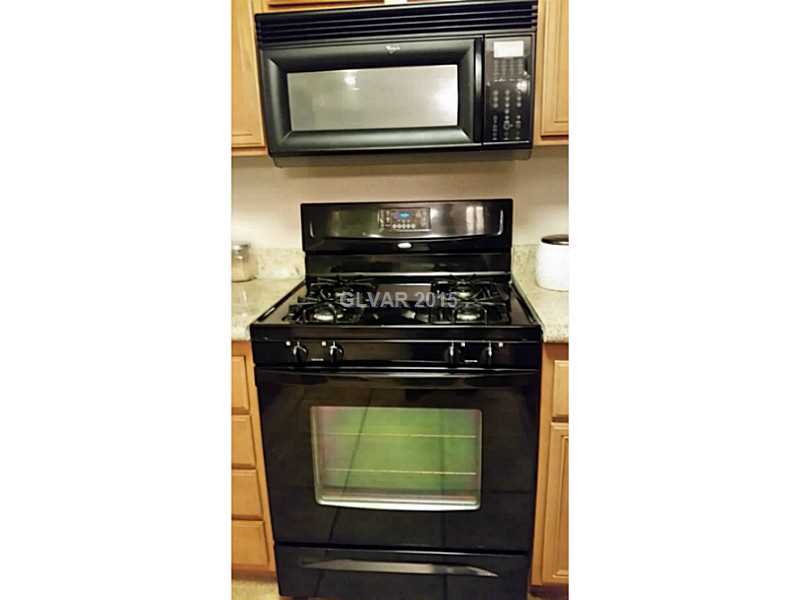 7701 West Robindale Road, Unit 145 Las Vegas, NV 89113 - Photo 9 of 34 Kitchen. All black appliances