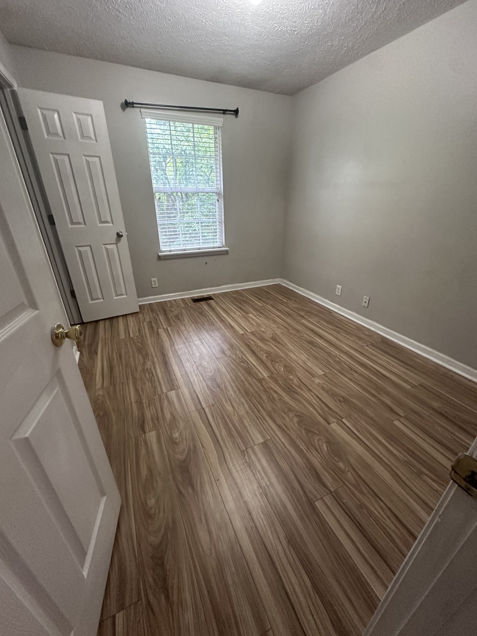 3001 Hamilton Church Road, Unit 403 Antioch, TN 37013 - Photo 19 of 21 a view of an empty room with wooden floor and a window