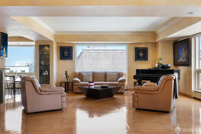 a view of a hallway with furniture and window