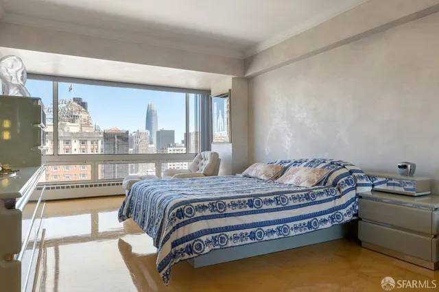 a living room with furniture and a floor to ceiling window