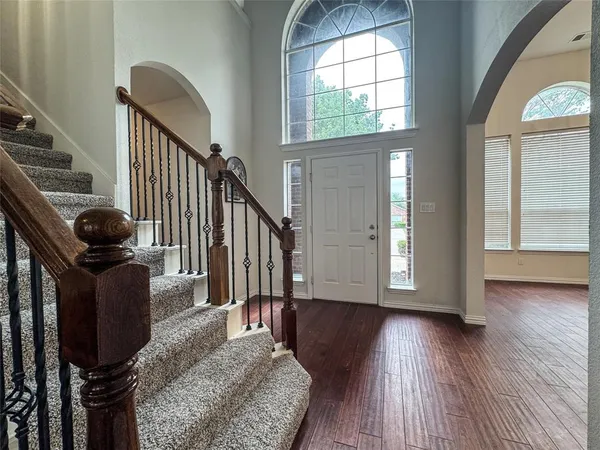 a view of a big room with a chandelier fan