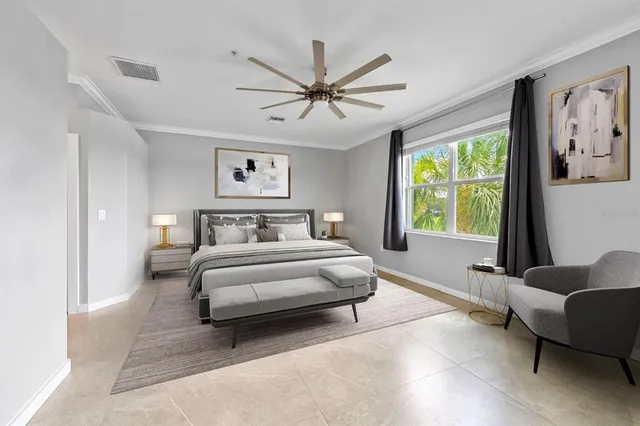 a spacious bedroom with a bed and a couch