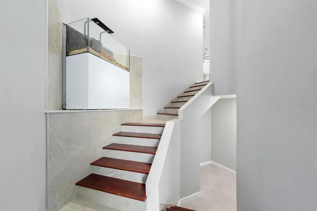 a view of a livingroom with furniture ceiling fan and window