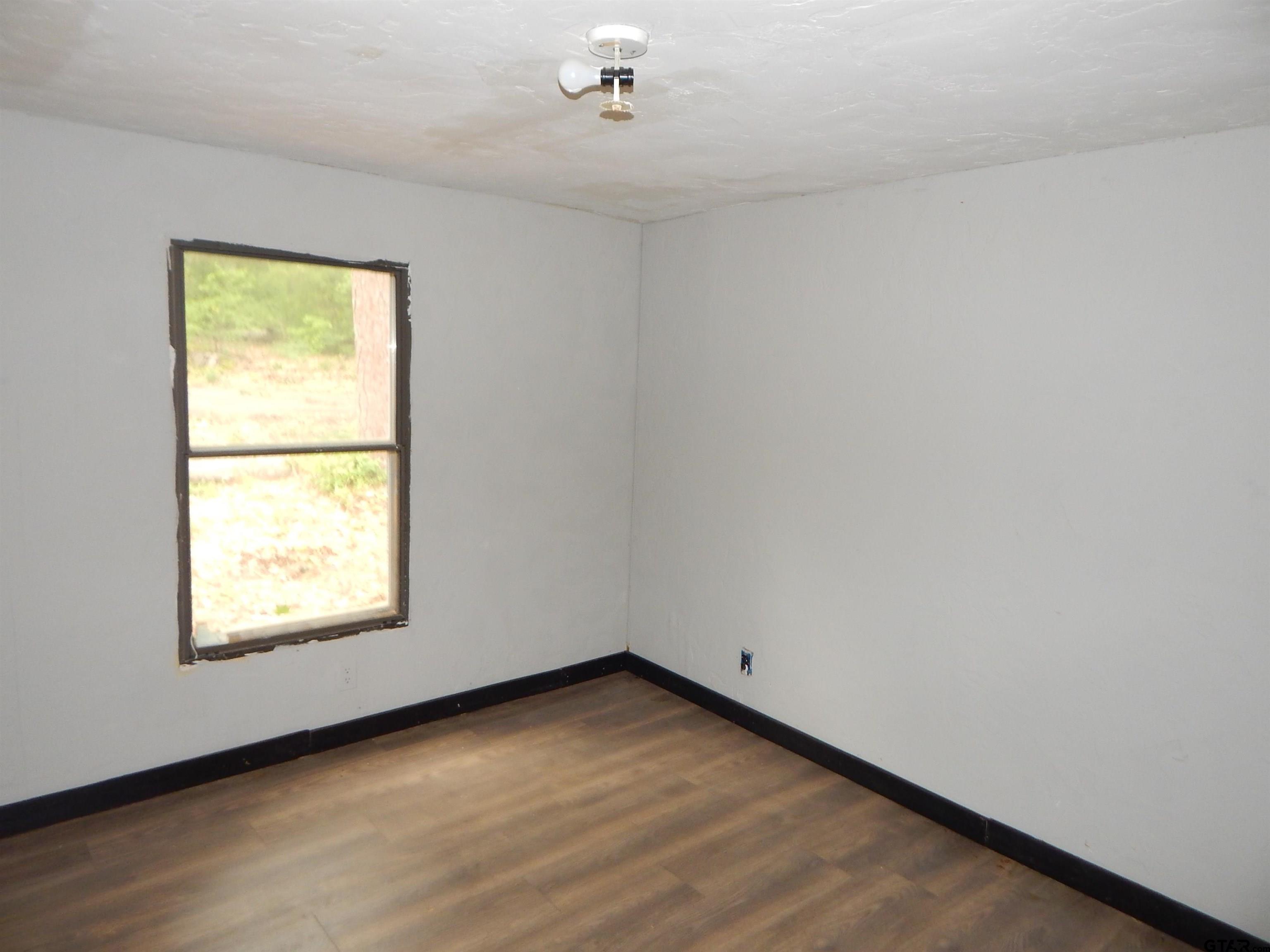 228 Gage Road Big Sandy, TX 75755 - Photo 6 of 13 an empty room with a window