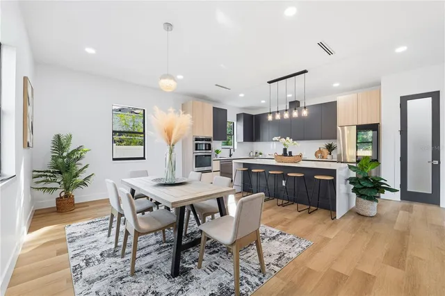 a kitchen with a sink and a stove top oven