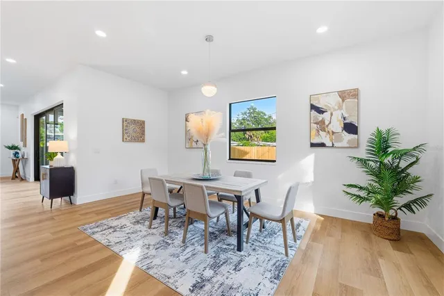 a view of hallway with wooden floor and staircase