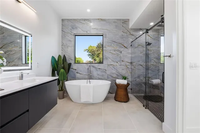 a white bath tub sitting in a bathroom