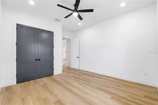 an empty room with a empty space and windows