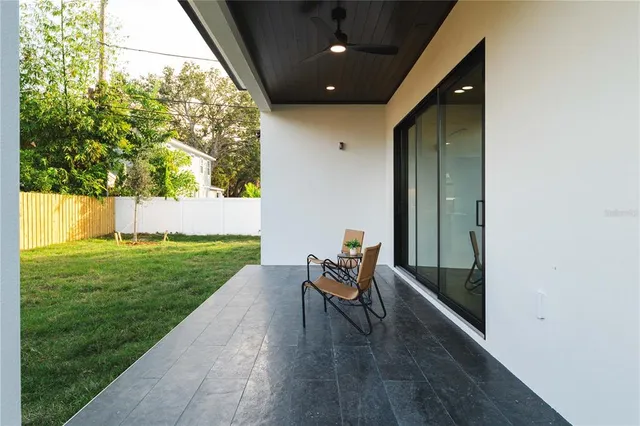 a aerial view of a house with a yard
