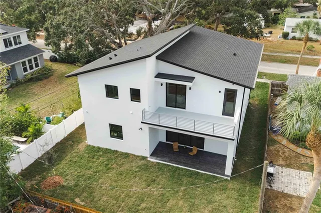 an aerial view of a house with a garden