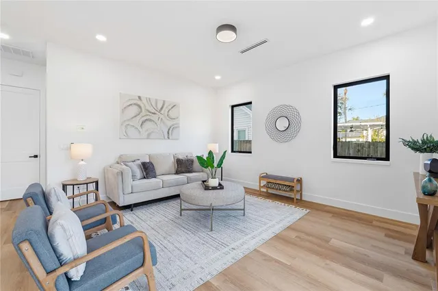 a living room with furniture and a rug