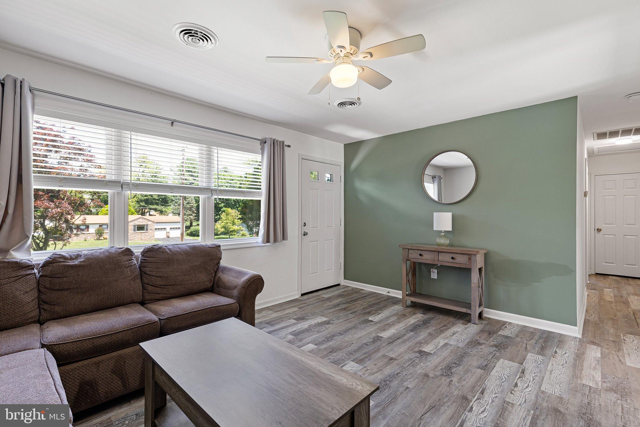 370 Big Elk Chapel Road Elkton, MD 21921 - Photo 5 of 29 a living room with furniture and a large window