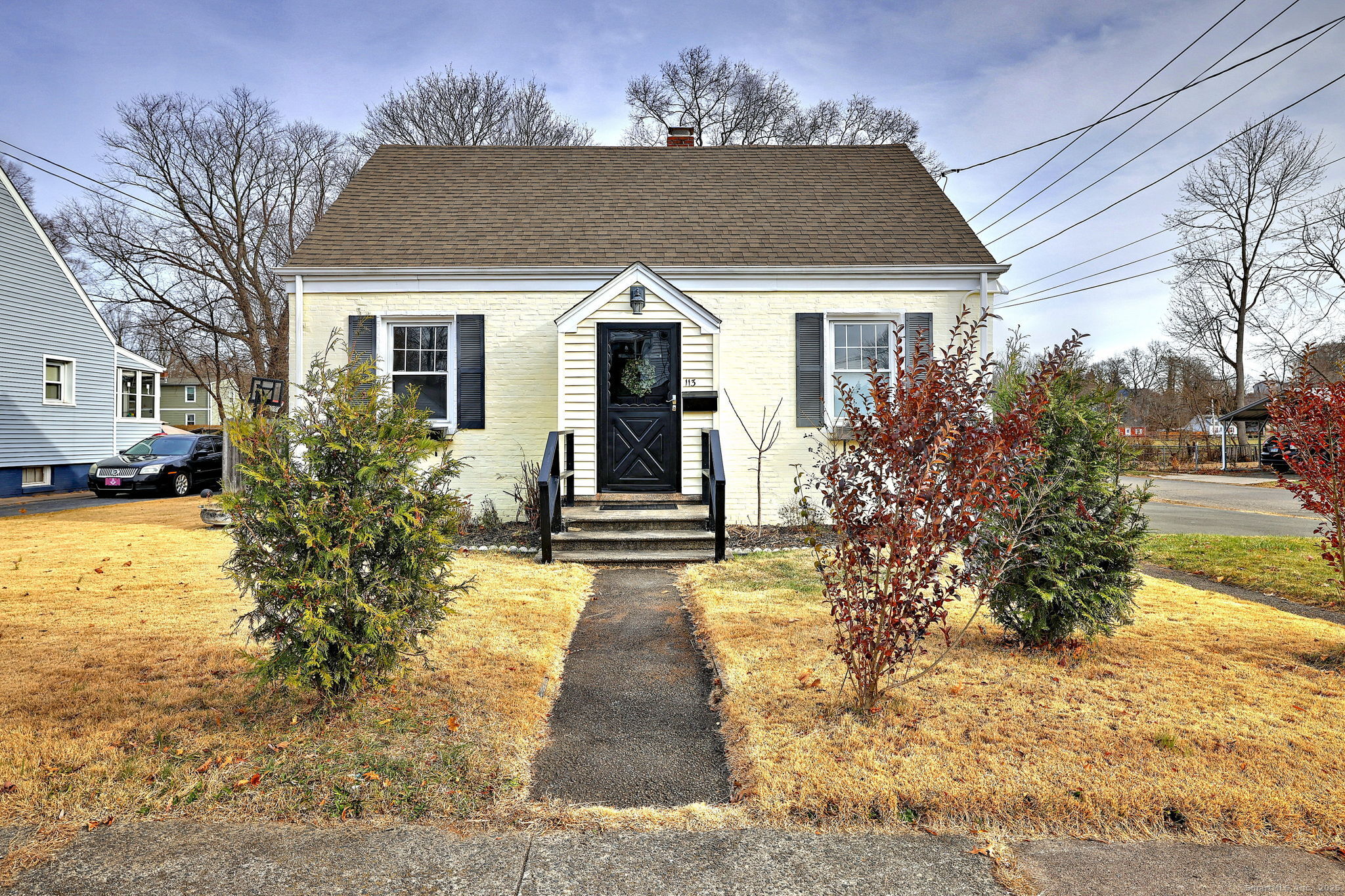 a front view of a house with garden