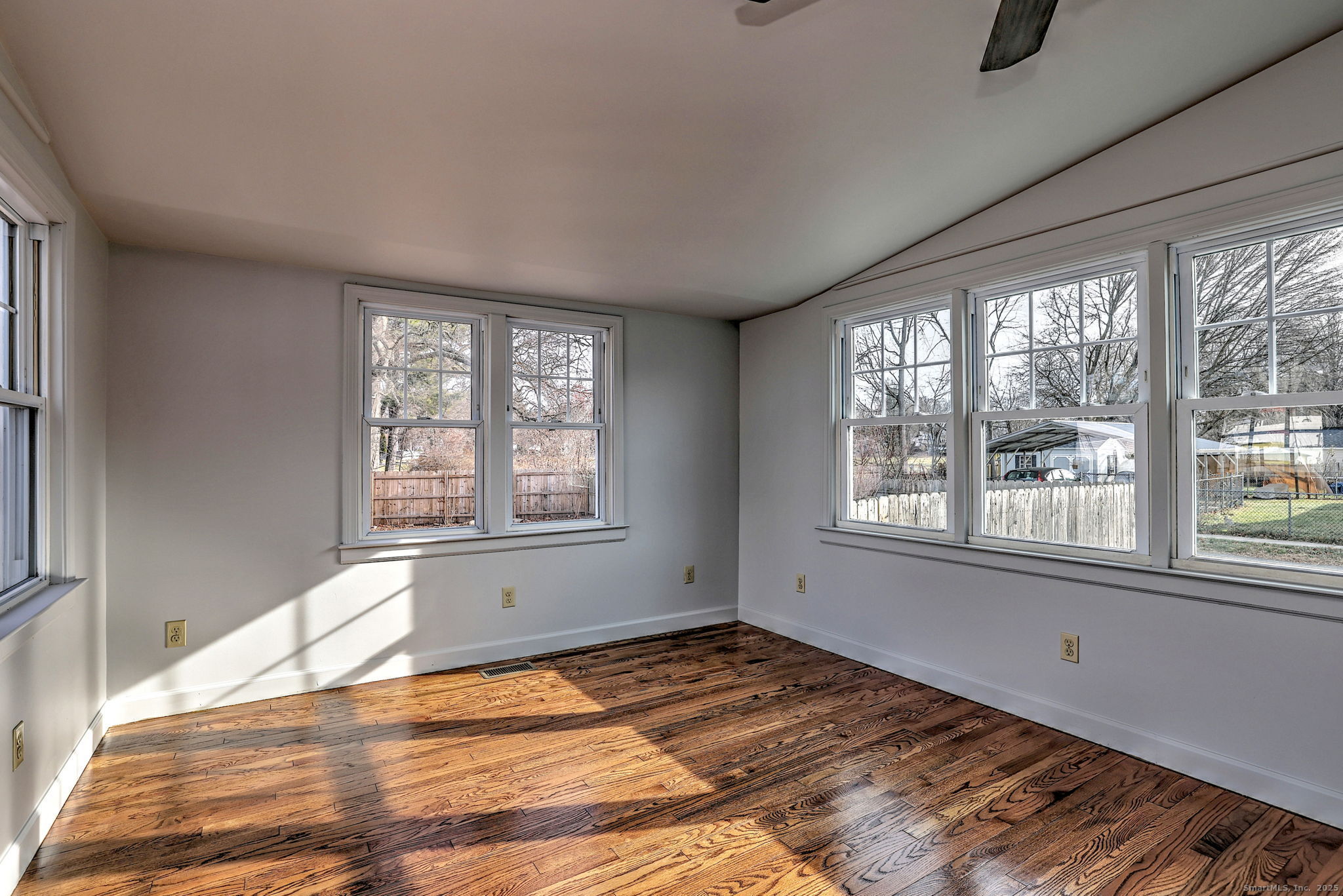 113 Chester Street Hamden, CT 06514 - Photo 17 of 40 a view of an empty room with wooden floor and a window