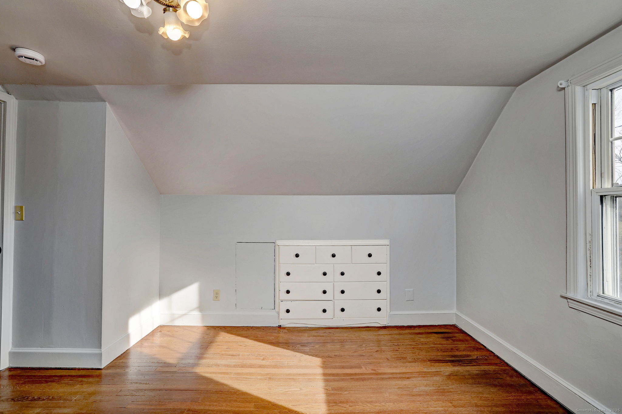 113 Chester Street Hamden, CT 06514 - Photo 29 of 40 a view of an empty room with wooden floor