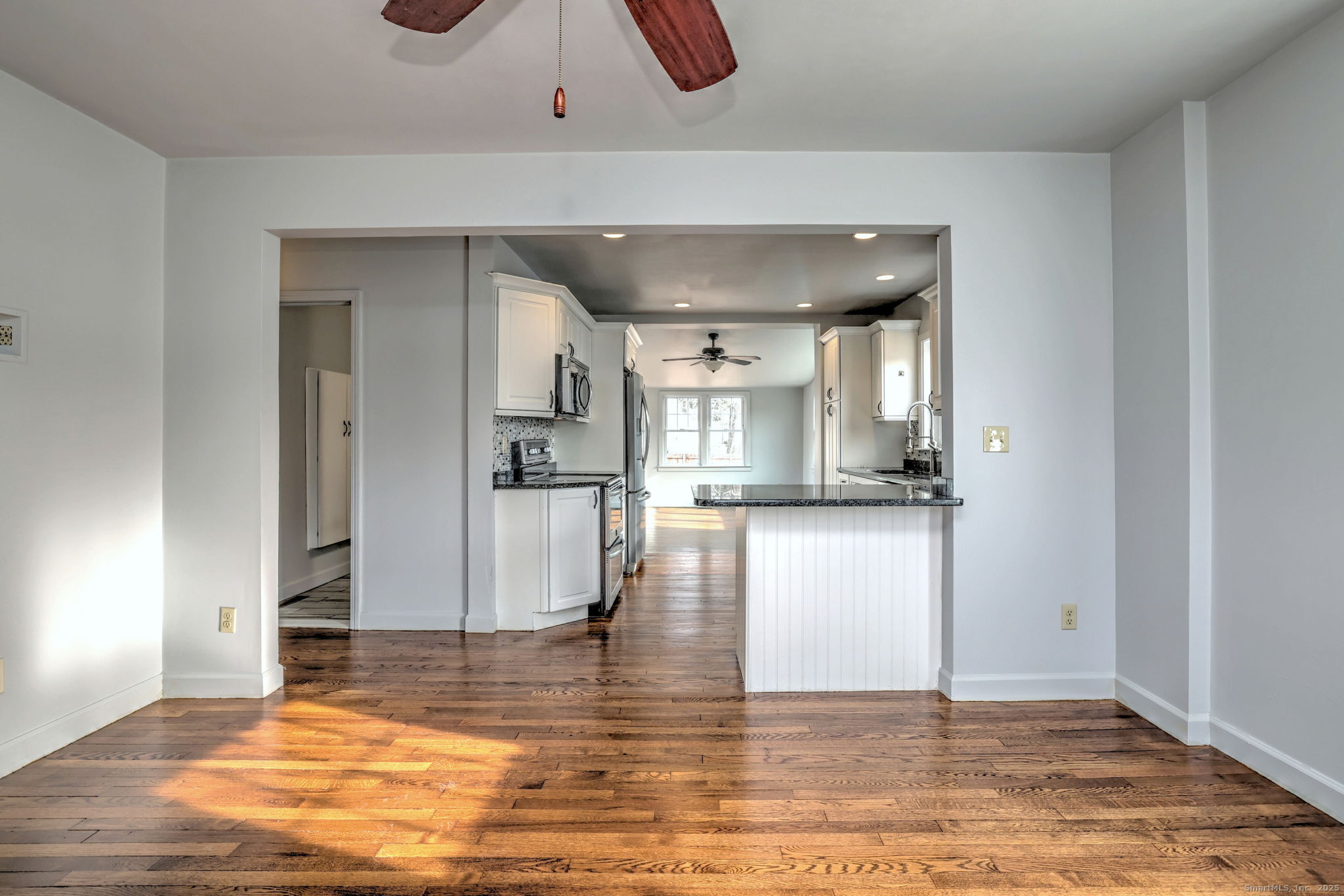 113 Chester Street Hamden, CT 06514 - Photo 4 of 40 a view of kitchen and hall with wooden floor