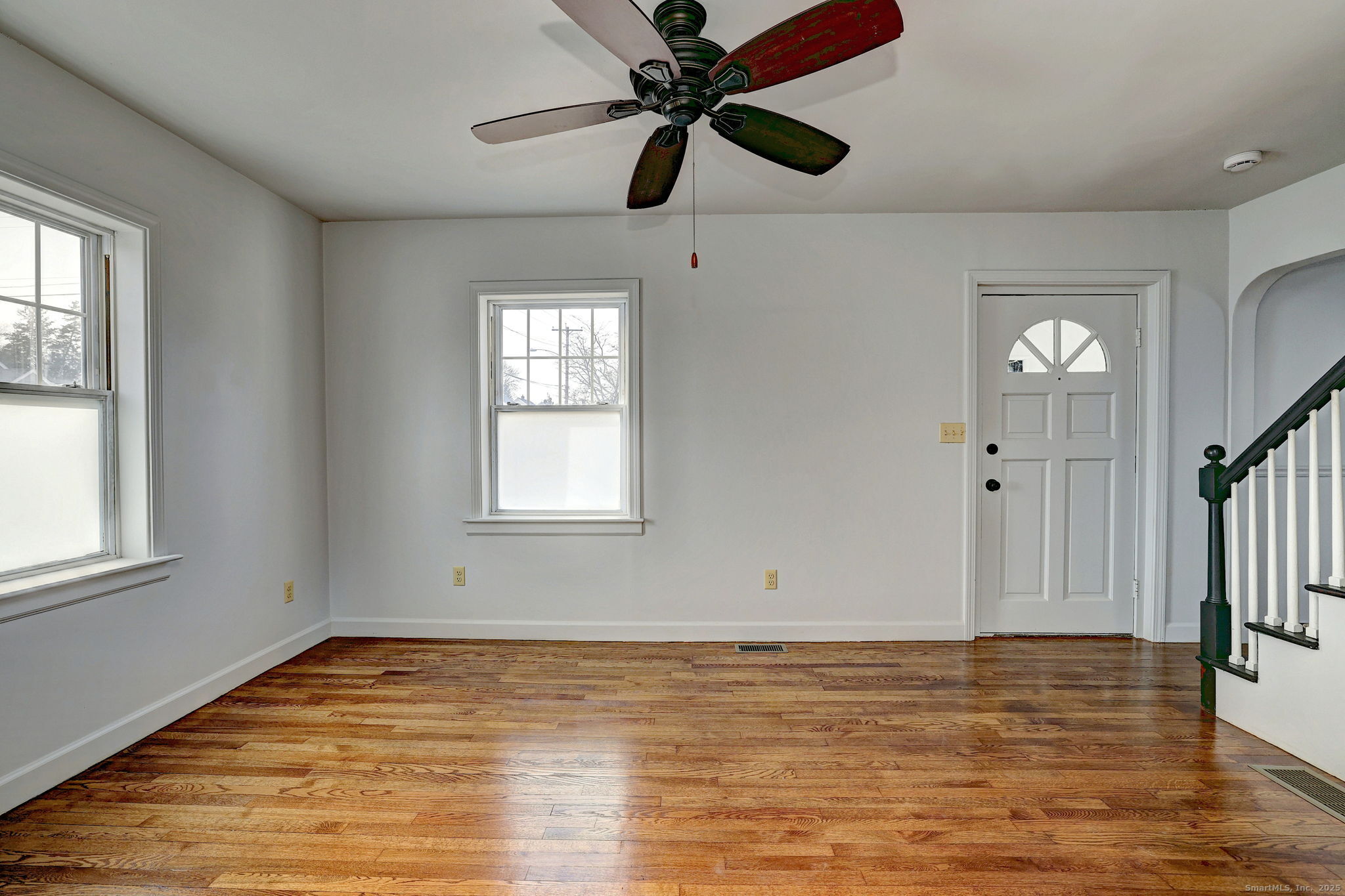 113 Chester Street Hamden, CT 06514 - Photo 7 of 40 a view of empty room with wooden floor and fan